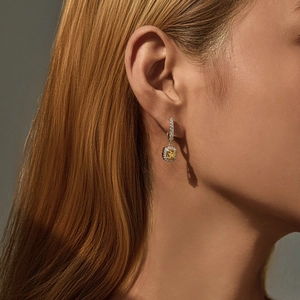 S925 sterling silver square yellow crystal huggie earrings worn by a model