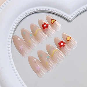 Sweet red flower and star press-on nails with wave patterns on an almond shape base