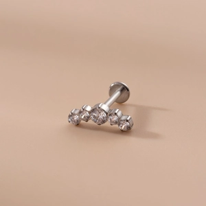 16G stainless steel lip stud with curved row of five round zircon stones for piercing