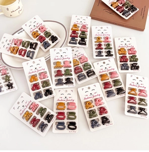 Close-up of assorted Morandi color mini hair claws in butterfly and floral shapes