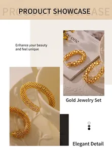 Detailed view of gold plated U-shaped earrings with intricate woven mesh texture