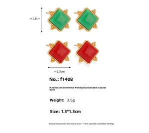 Detail of geometric quadrilateral gold earrings with natural green and red stones