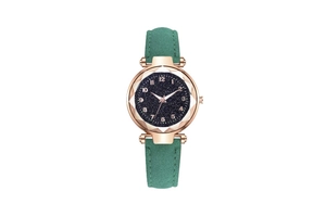 Detail of starry blue dial and green suede strap with rose gold case and faceted glass