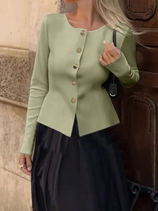 Close-up of green slim-fit knit cardigan with decorative gold buttons and ribbed texture