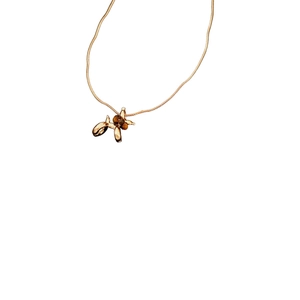 Golden balloon dog necklace with brown tiger eye beads on elegant snake chain