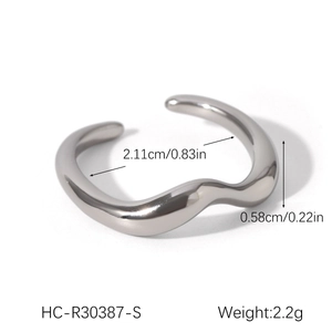 Detailed view of silver wavy stainless steel ring showing 2.11cm diameter measurement