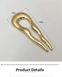 Detail view of a 88mm golden minimalist U-shaped hair fork with smooth wave texture