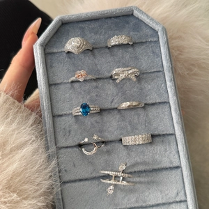 Selection of S925 sterling silver rings with heart, bow, and blue gemstone designs