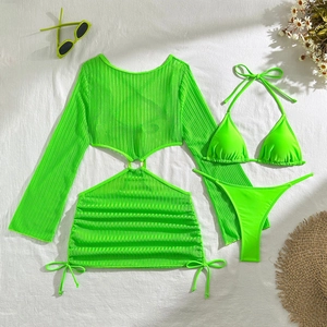 Flat lay of neon green mesh cover-up and matching three-piece bikini set for beachwear