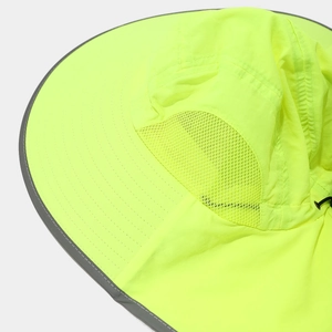 Close-up of fluorescent safety hat featuring breathable mesh and reflective trim details