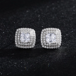 Sparkling double halo square cubic zirconia 925 silver stud earrings on black background