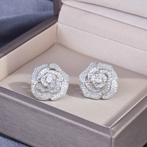 Elegant silver camellia flower stud earrings with pavé crystals in a gift box
