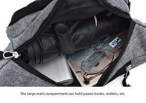 Detailed view of the large capacity grey fabric waist bag showing a spacious main compartment