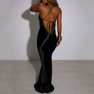 Detail view of black backless evening dress with elegant silk-like fabric and cross straps