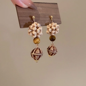 Bohemian dangle earrings with tiger eye stone and patterned wooden beads on a silver needle