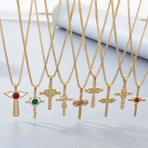 Detail view of nine gold cross necklaces with colorful gems, pearls and rhinestones