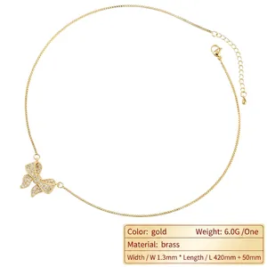 Gold plated brass bow necklace with cubic zirconia pendant and 1.3mm thin chain