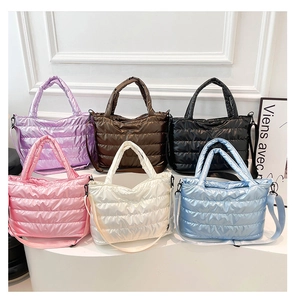 Collection of quilted down cotton tote bags in six vibrant colors for women