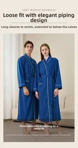 Detail of dark blue waffle robe featuring white elegant piping and textured long sleeves