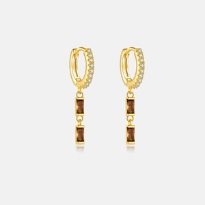 Detail shot of gold S925 sterling silver hoop earrings with rectangular brown gemstones