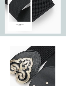 Detail view of black elastic corset belt featuring an ornate gold floral metal buckle