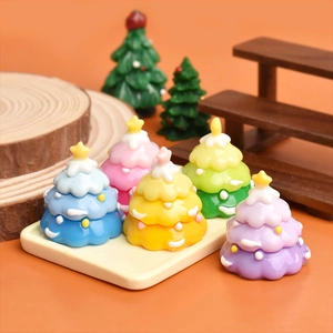 Detailed view of colorful gradient mini resin Christmas trees for DIY cake decor