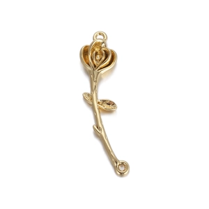 Detail of a golden 3D rose flower pendant with textured metallic finish and fine craftsmanship