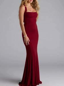 Detail of elegant dark red evening dress featuring a halter neckline and slim mermaid cut