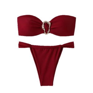 Burgundy two-piece bandeau bikini set with elegant gold metal ring detail on plain white background