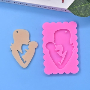 Pink silicone mold and finished mother and child silhouette pendant for DIY crafts
