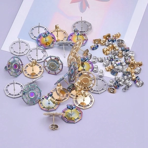 304 stainless steel stud earring bases in gold, silver, and rainbow finishes on purple background