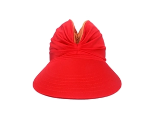 Detailed close-up of a red wide-brim sun hat featuring a breathable pleated fabric design