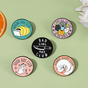 Set of five colorful round enamel pins featuring cat and lifestyle club slogans for clothing