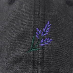 Dark grey washed cotton baseball cap featuring purple lavender embroidery on the front