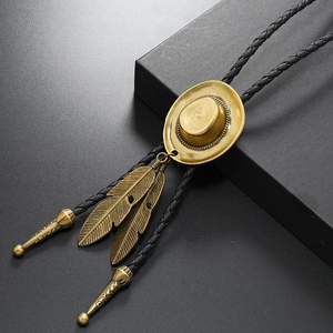Vintage bronze western cowboy hat bolo tie with feather pendants on black braided cord