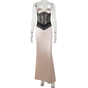 Detail of elegant champagne satin evening gown featuring black lace waist trim and slit