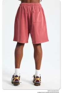Rear view of heavy cotton brick red men's shorts showing textured knit fabric detail
