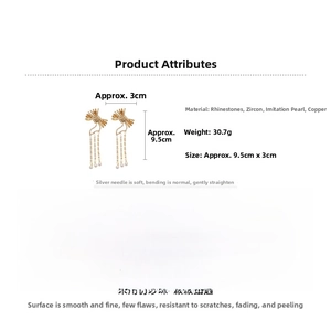 Detailed view of bow tassel earrings with dimensions 9.5cm by 3cm and 30.7g weight