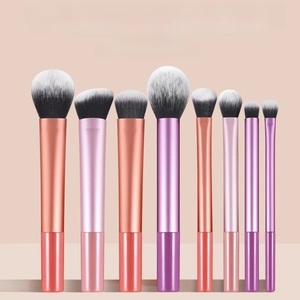Detail shot of 8 professional multi-colored makeup brushes with gradient long tubes