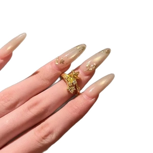 Gold plated star open ring with sparkling cubic zirconia on a model's finger