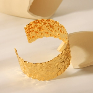 18K gold plated stainless steel open bangle featuring a unique hammered texture finish