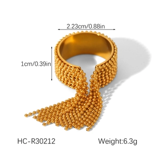 Detailed view of golden tassel ring with dimensions and weight 6.3g on white background