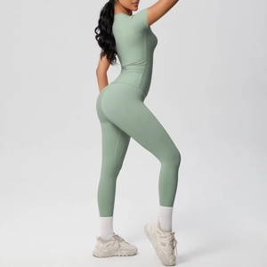 Detail of mint green two-piece yoga set featuring high-waist leggings and short sleeve top