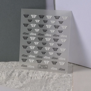 Detailed macro view of 5D embossed butterfly nail stickers with intricate 3D patterns