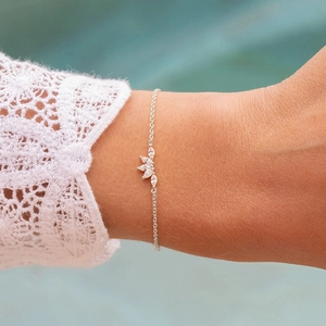 Close-up of S925 silver marquise crown bracelet worn by a model with lace details