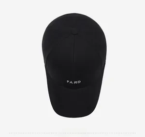 Detailed close-up of a black baseball cap with white FARD letter embroidery and top view