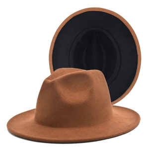 Detail view of a two-tone wool fedora hat with wide brim and brown black contrast