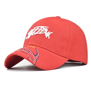 Detailed view of red cotton baseball cap with 3D white embroidery and curved brim