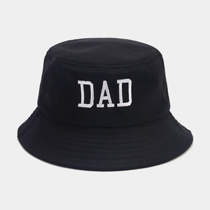 Close-up of DAD embroidery on black cotton bucket hat with multi-row stitched brim