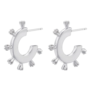 Detail view of silver C-shaped stud earrings with micro-pave crown-set cubic zirconia